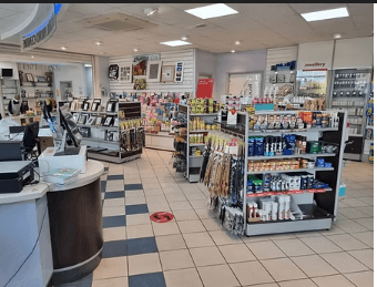 Inside Goshen Pharmacy with pharmacy counters and shelves